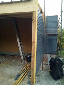 Réalisation d'un garage ossature bois avec lamellé collé, bardage bois, couverture tôle bac à BESSE SUR BRAYE (72).